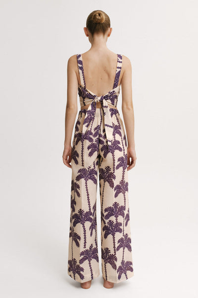 Back view of  Matching Set showing bow-tie cropped top and wide-leg pants in palm print – Resort 2026 collection.”