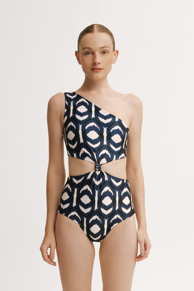 Model wearing Sabrina Ikat One Piece with one-shoulder neckline and waist cut-out.