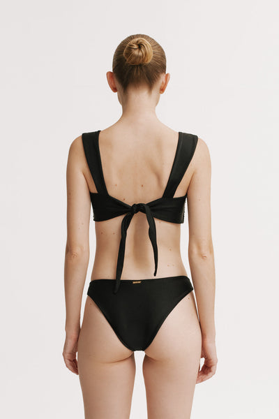 Black bikini with open back design on a white background