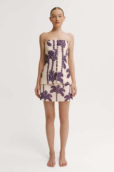 Model wearing a  top and Skirt mini length set with purple palm print – Resort 2026 resortwear.