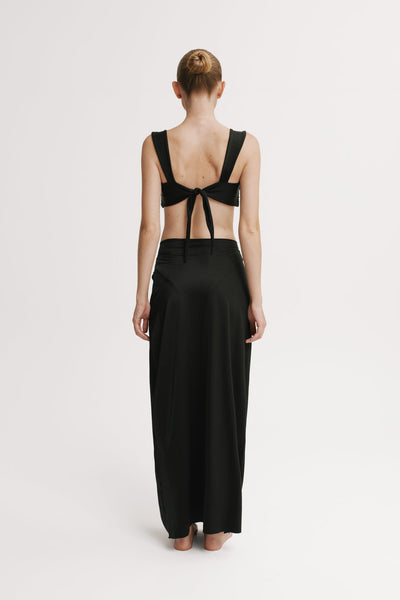 Back view of model wearing Black floor-length skirt