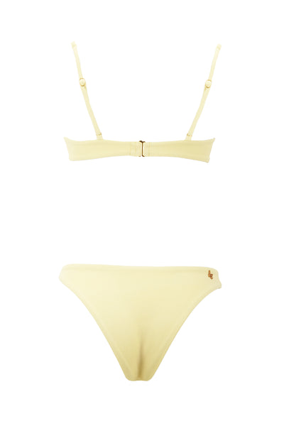 Yellow bikini top and bottom set on a white background
