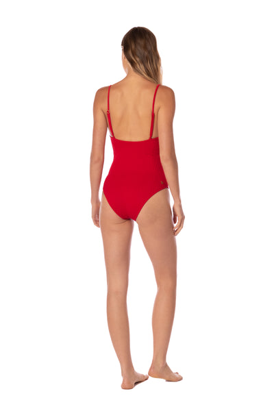 Red swimsuit worn by a model on a white background