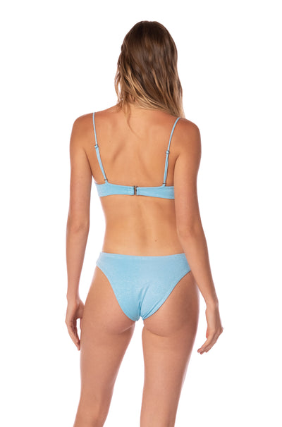 Black of a Woman wearing a light blue bikini on a white background.