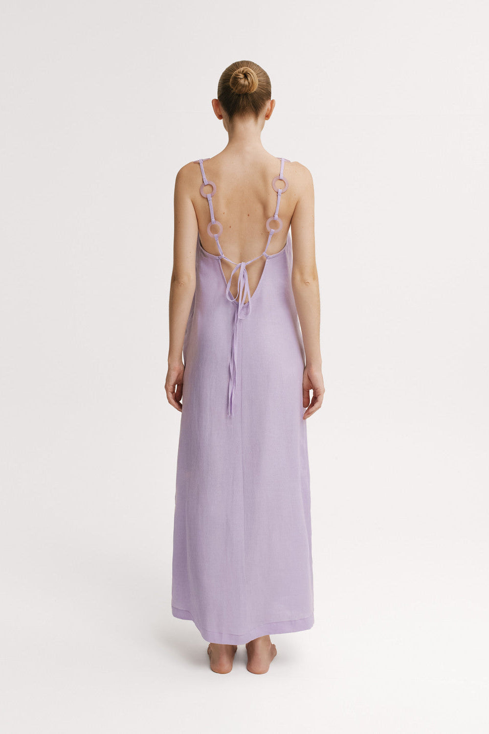 Back view of Mar de Lua Evie Malva Dress showing open back and tie closure.