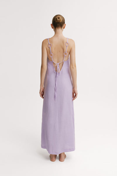 Back view of Mar de Lua Evie Malva Dress showing open back and tie closure.