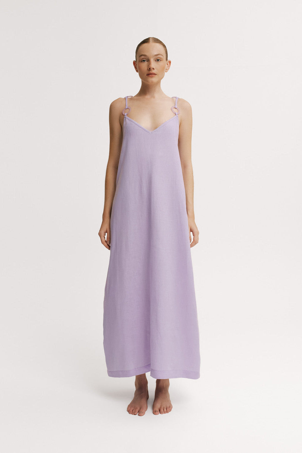 Front view of model wearing a lavender linen maxi dress with ring strap detail.