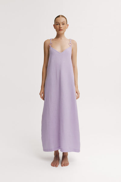 Front view of model wearing a lavender linen maxi dress with ring strap detail.
