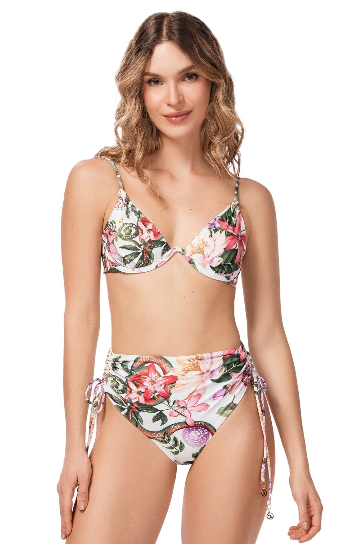 Woman wearing a floral bikini set on a white background