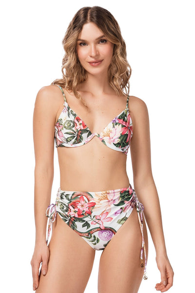 Woman wearing a floral bikini set on a white background