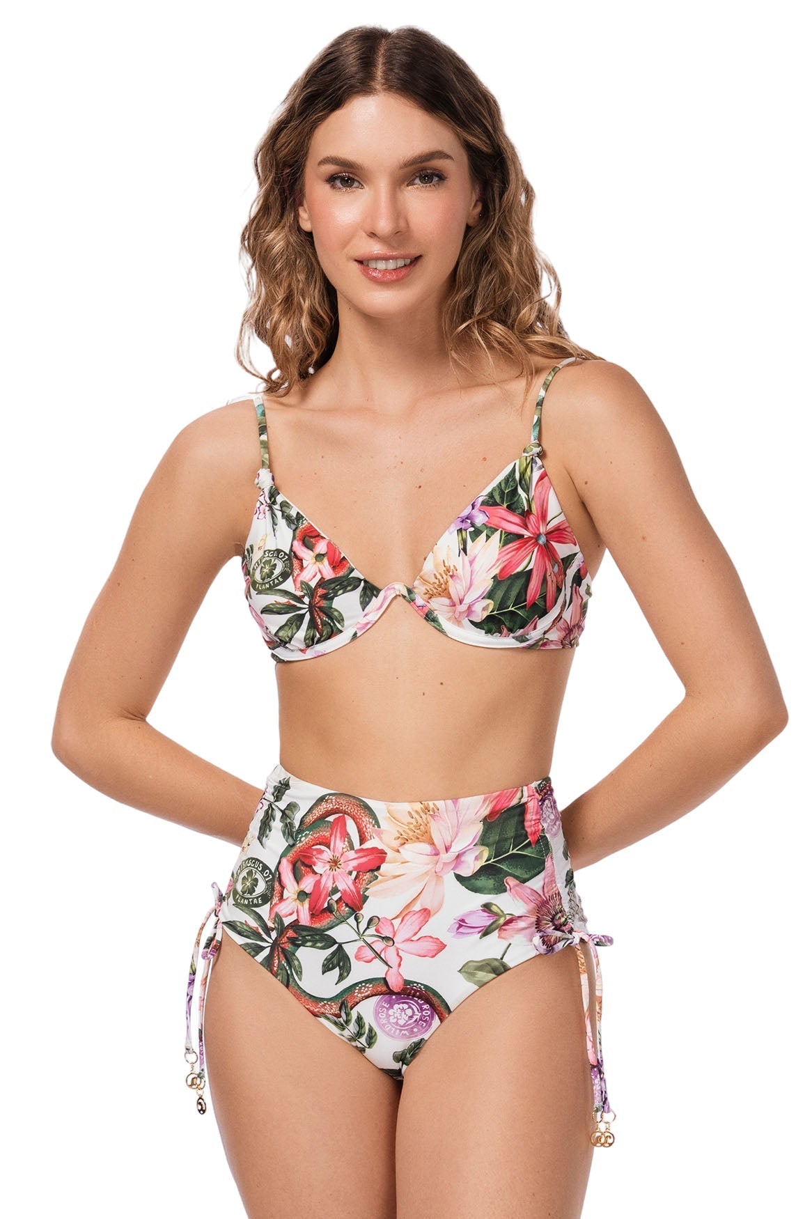 Woman wearing a floral bikini set on a white background
