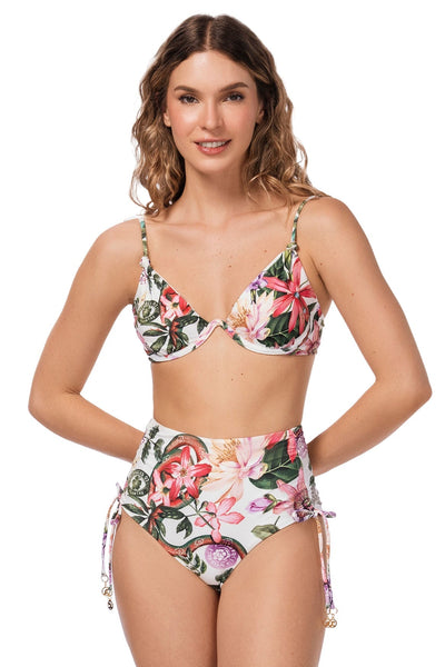 Woman wearing a floral bikini set on a white background