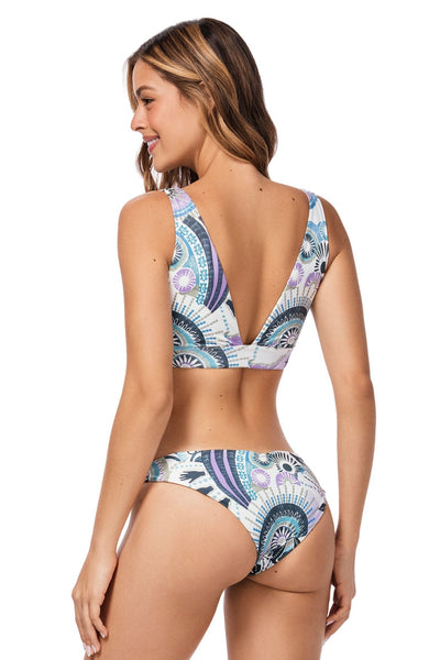 Low-rise bikini bottom in multicolor engineered print, made from eco-friendly fabric, featuring side cutouts, moderate back coverage, and a reversible design for versatile styling.







