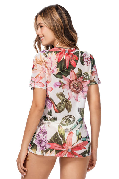 Woman wearing a floral short-sleeve top on a white background