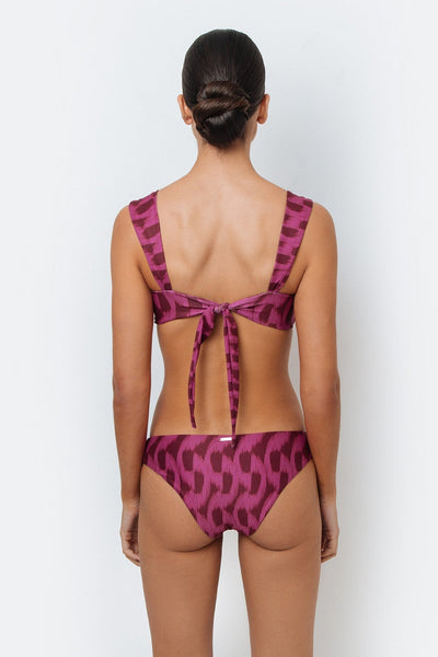 Purple patterned bikini set on a white background