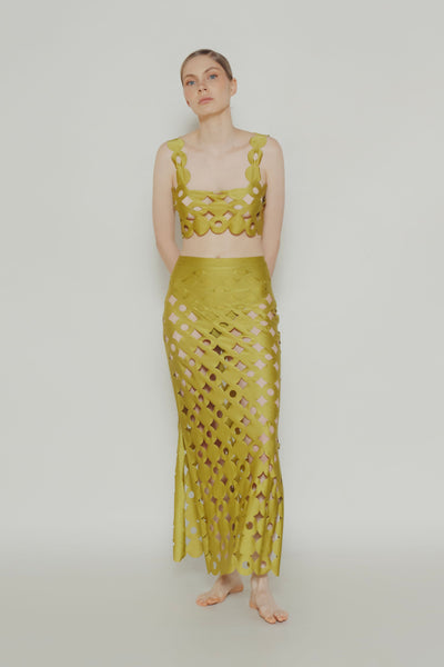 Laser-cut maxi skirt SET with circular seashell-inspired patterns.